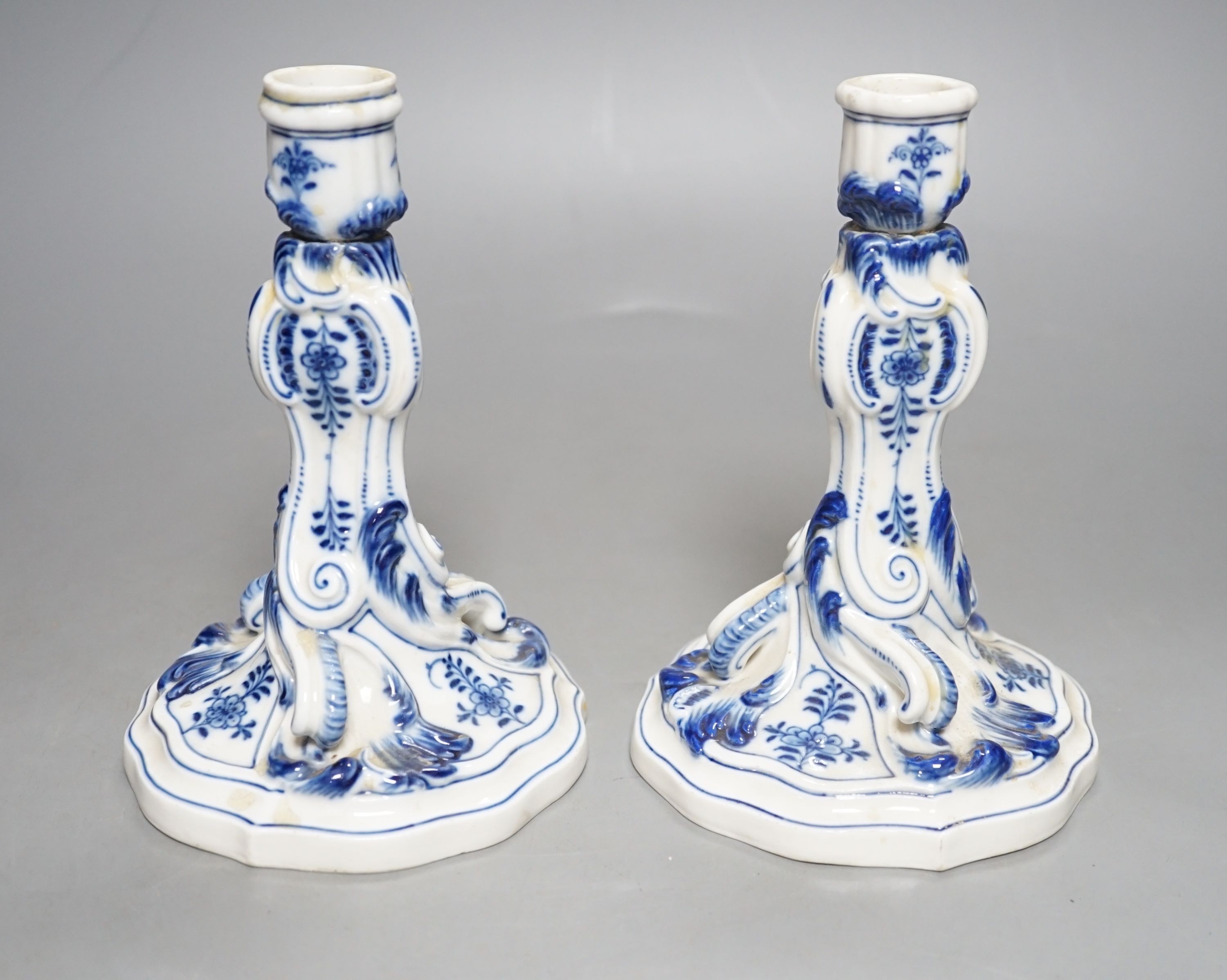A pair of late 19th century blue and white Meissen onion pattern candlesticks - 17cm tall